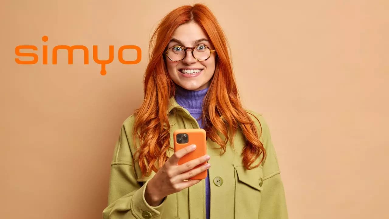 mobile services online communication concept pleased beautiful redhead young woman holds modern mobile phone smiles toothily dressed fashionable autumn jacket mobile services online communication concept pleased beautiful redhead young woman holds modern mobile phone smiles toothily dressed fashionable autumn jacket